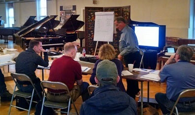 Student learning piano at randy potter school